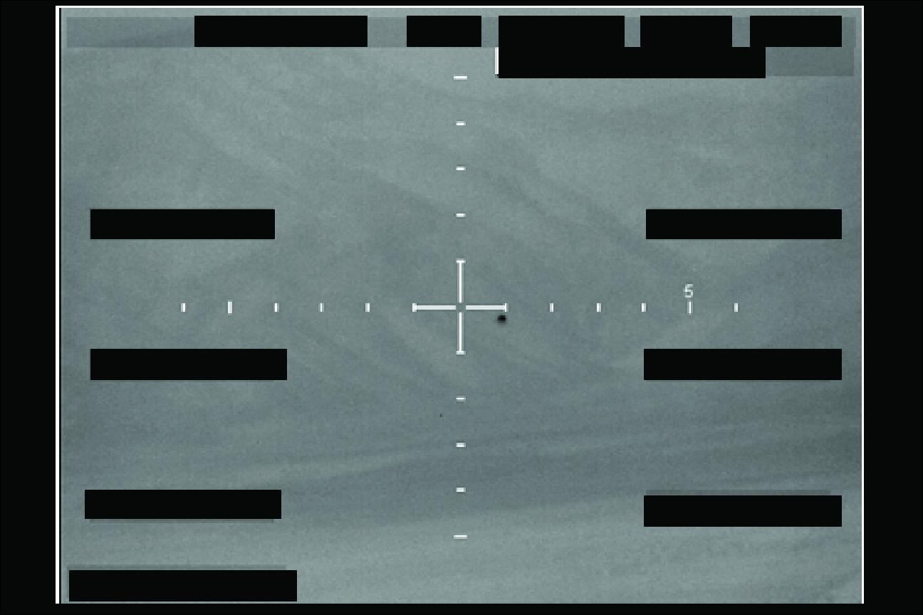 A redacted FBI sensor still showing crosshairs over what appears to be a small dark object